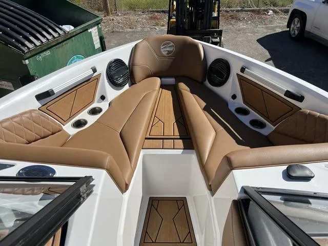 Slide: The Image of 2023 Tigé Z3 boat interior with tan leather seats and wood accents. - 5