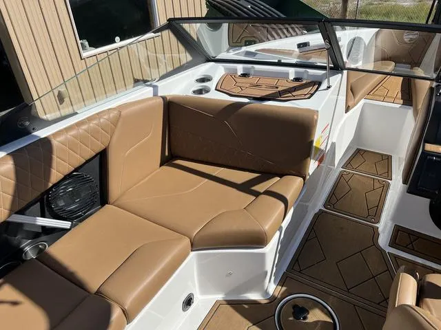 Slide: The Image of 2023 Tigé Z3 boat interior with tan leather seating and modern design. - 8