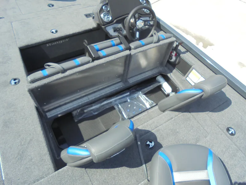 Slide: The Image of 2024 Ranger RT178C boat interior with gray and red seating, featuring a swivel chair. - 11