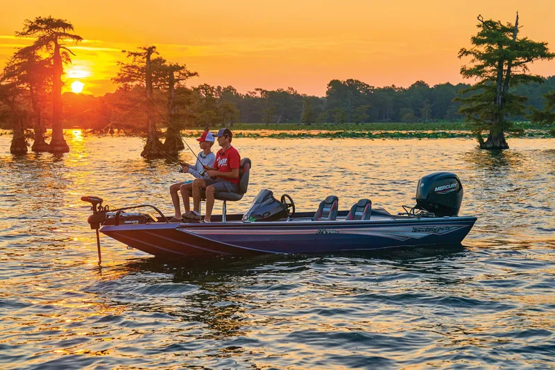 Slide: The Image of 2024 Ranger RT178C boat on a lake at sunset with two people fishing. - 47