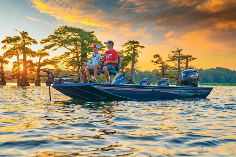Slide: The Image of 2024 Ranger RT178C boat on a serene lake at sunset with two people fishing. - 48