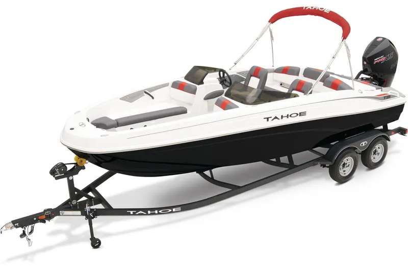 Slide: The Image of 2024 Tahoe T21 boat on trailer outside Bass Pro Shops, under clear sky. - 10