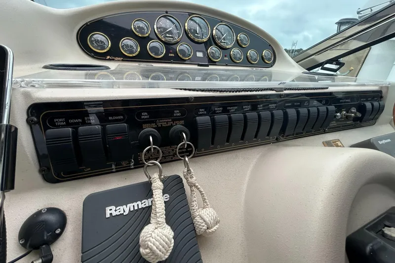 Slide: The Image of Control panel of a 2000 Cruisers Yachts 3870 Express with Raymarine equipment. - 13