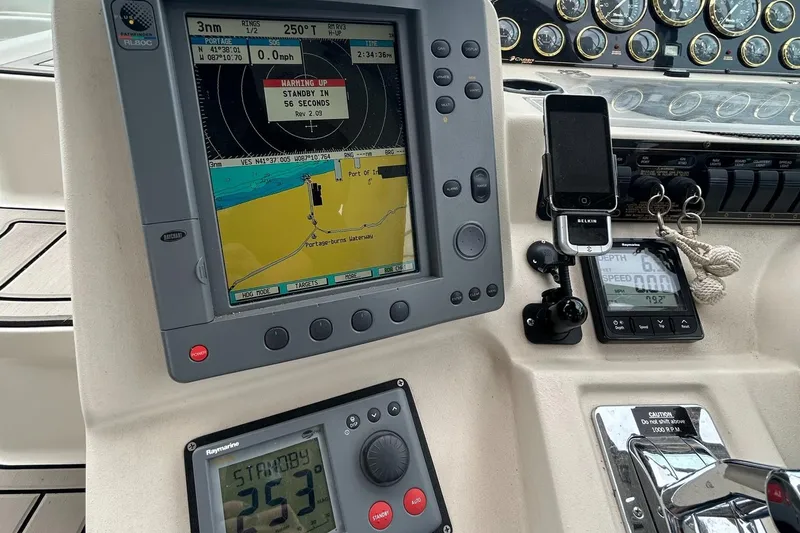 Slide: The Image of Control panel of a 2000 Cruisers Yachts 3870 Express with navigation equipment. - 18