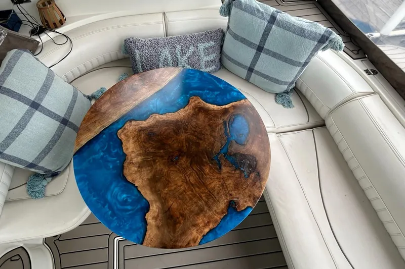 Slide: The Image of Round wooden and blue resin table on a 2000 Cruisers Yachts 3870 Express. - 31