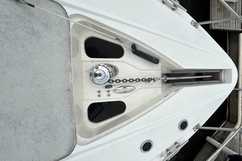 Slide: The Image of 2000 Cruisers Yachts 3870 Express bow with anchor chain and windlass. - 43