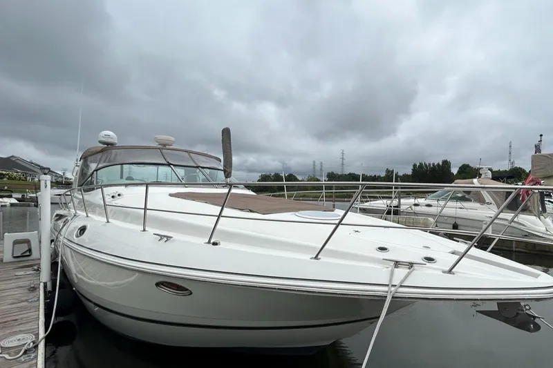 Slide: The Image of 2000 Cruisers Yachts 3870 Express docked, front view. - 49