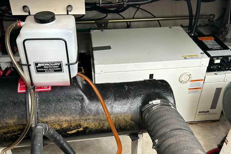 Slide: The Image of Engine compartment of a 2000 Cruisers Yachts 3870 Express with Mercury coolant recovery system. - 5