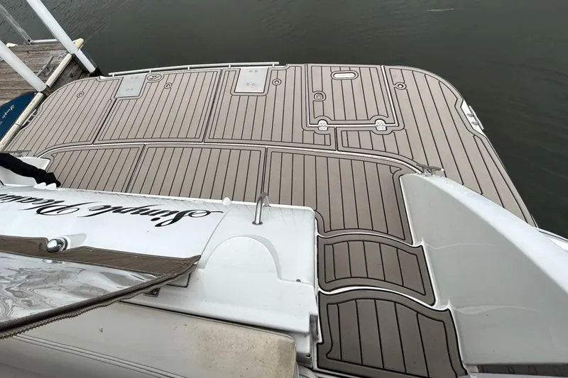 Slide: The Image of 2000 Cruisers Yachts 3870 Express swim platform with custom decking. - 6