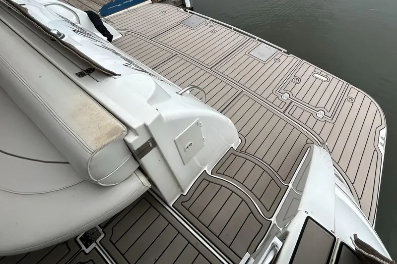 Slide: The Image of 2000 Cruisers Yachts 3870 Express deck with custom non-slip flooring. - 8