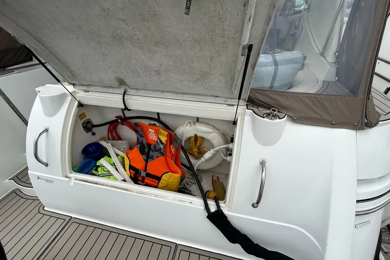 Slide: The Image of Storage compartment on a 2000 Cruisers Yachts 3870 Express with life jackets and boating gear. - 9