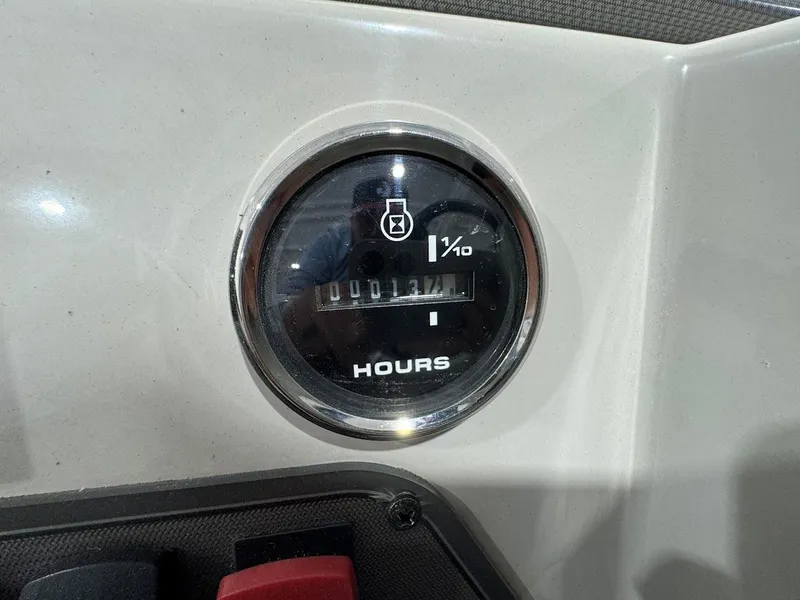 Slide: The Image of Hour meter on 2023 Crest Classic Platinum 220 dashboard, displaying usage time. - 10