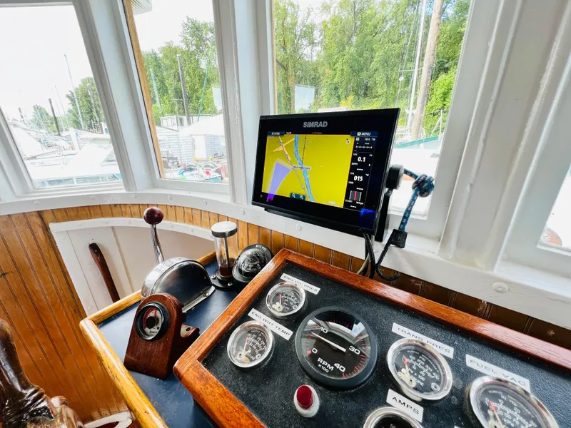 Slide: The Image of Colin Archer 42 (1955) boat helm with navigation system and gauges. - 13
