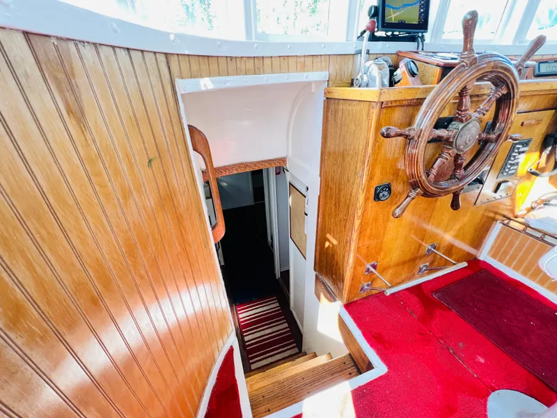 Slide: The Image of Interior of 1955 Colin Archer 42 boat with wooden helm and staircase. - 17
