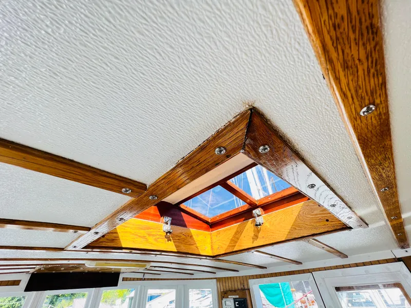 Slide: The Image of Interior ceiling of 1955 Colin Archer 42 boat with wooden trim and skylight. - 36