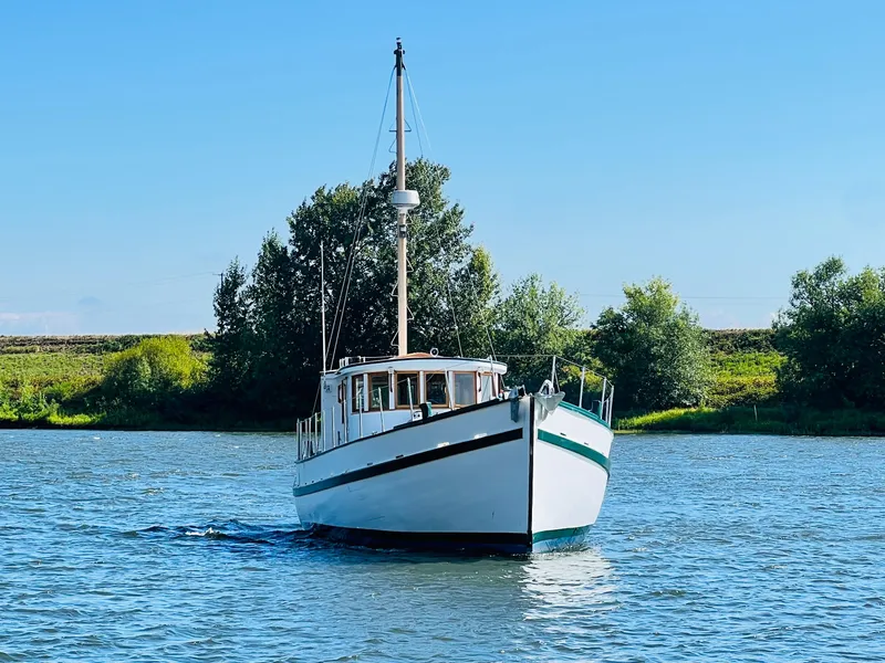 Slide: The Image of 1955 Colin Archer 42 boat cruising on a sunny day. - 46
