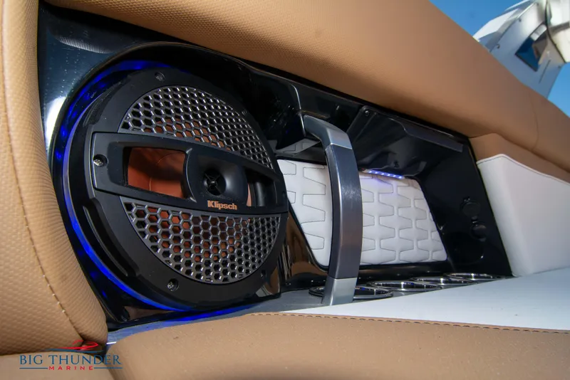 Slide: The Image of 2023 MasterCraft X24 boat interior with Klipsch speaker and premium upholstery. - 21