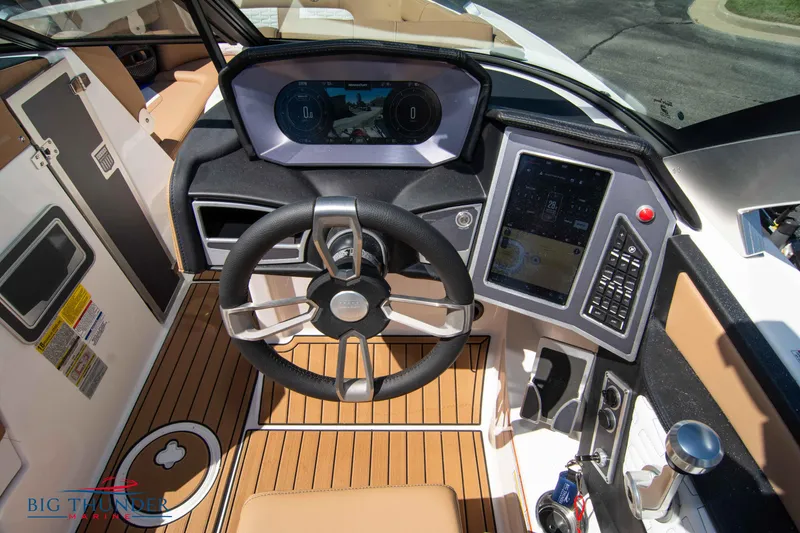 Slide: The Image of 2023 MasterCraft X24 boat dashboard with advanced controls and touchscreen display. - 33
