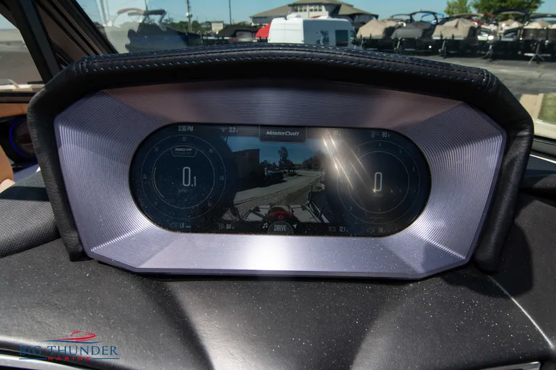 Slide: The Image of 2023 MasterCraft X24 dashboard with digital display and rearview camera. - 35