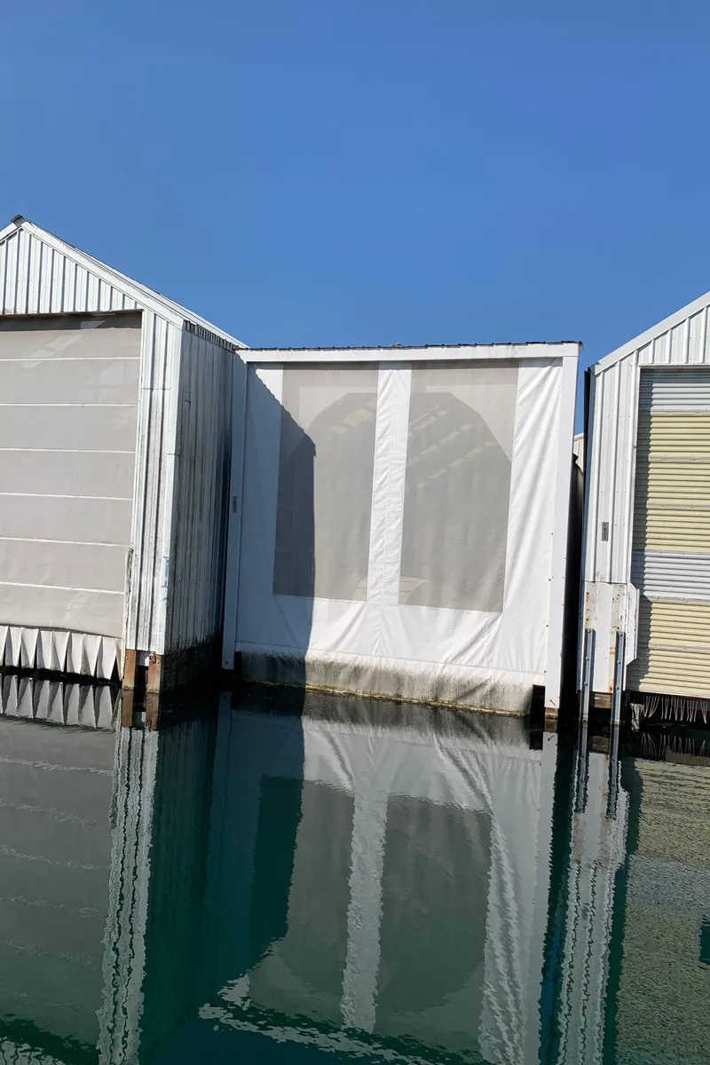 Slide: The Image of Covered dock for 2014 Ranger Tugs Trawler on calm water. - 4