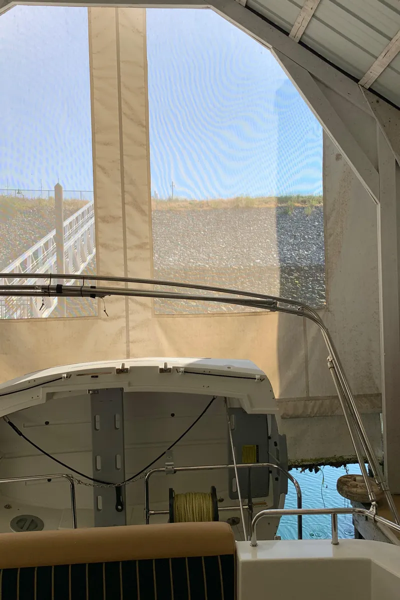 Slide: The Image of 2014 Ranger Tugs Trawler docked in a covered marina. - 9