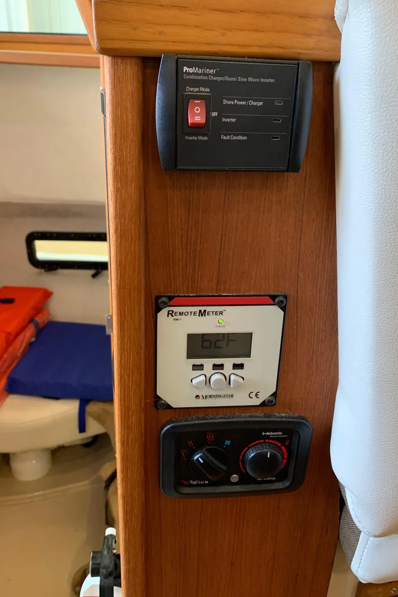 Slide: The Image of Control panel inside a 2014 Ranger Tugs Trawler boat. - 16