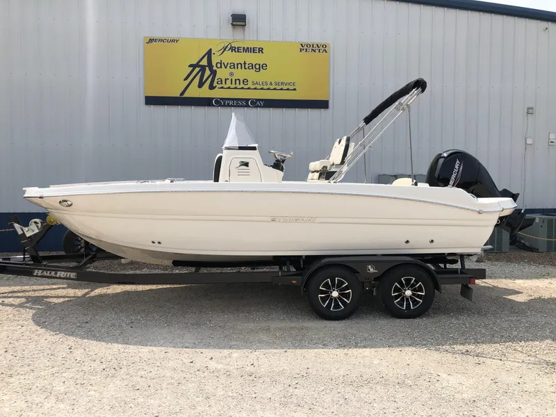Slide: The Image of 2024 Stingray 216 CC boat on trailer at Premier Advantage Marine. - 0