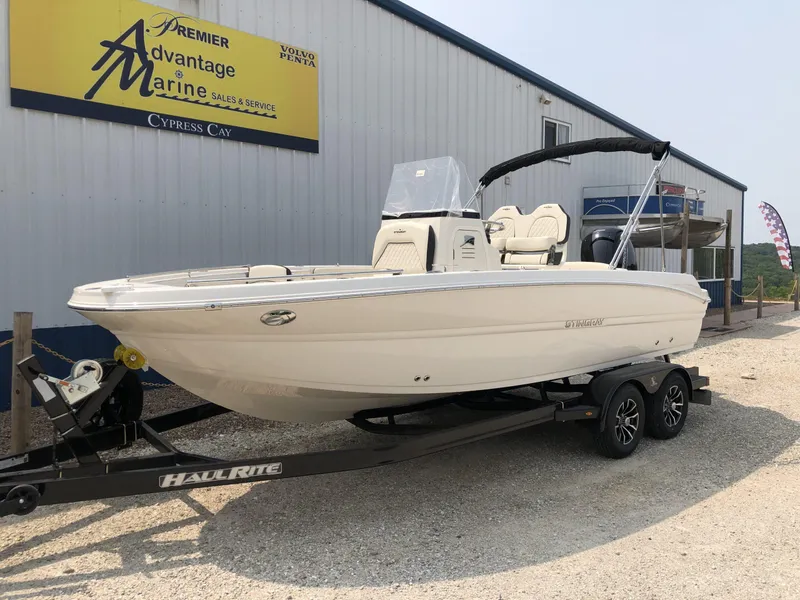 Slide: The Image of 2024 Stingray 216 CC boat on trailer at Premier Advantage Marine. - 1