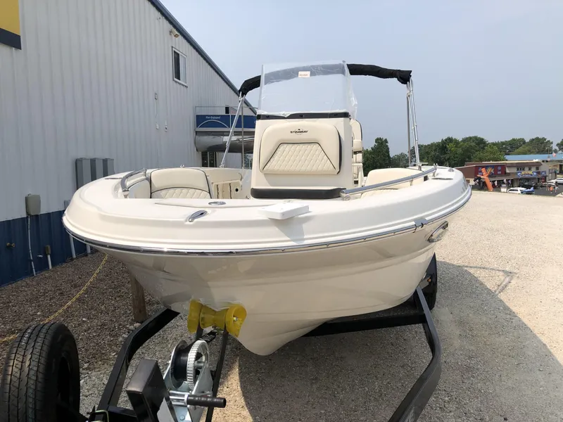 Slide: The Image of 2024 Stingray 216 CC boat on trailer, front view. - 2