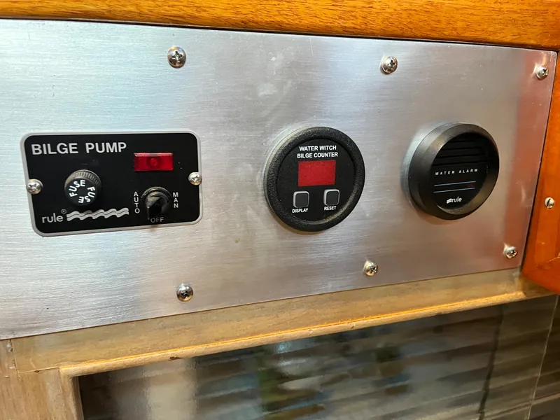 Slide: The Image of Control panel of a 1962 Chris-Craft Constellation boat with bilge pump switches. - 13