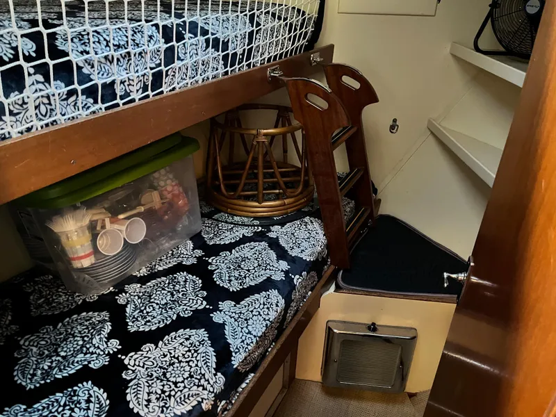 Slide: The Image of 1962 Chris-Craft Constellation cabin interior with bunk beds and storage. - 16