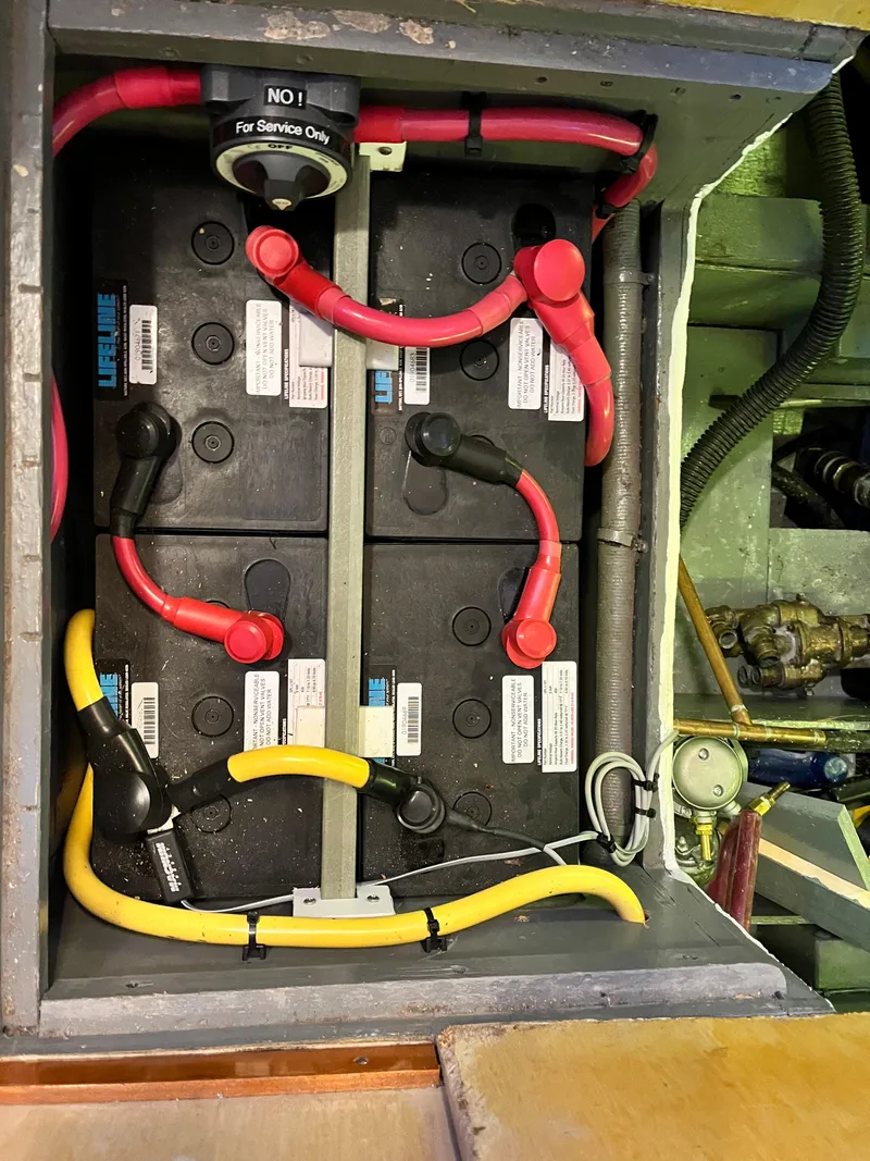 Slide: The Image of Battery compartment of a 1962 Chris-Craft Constellation boat with wiring and connectors. - 20