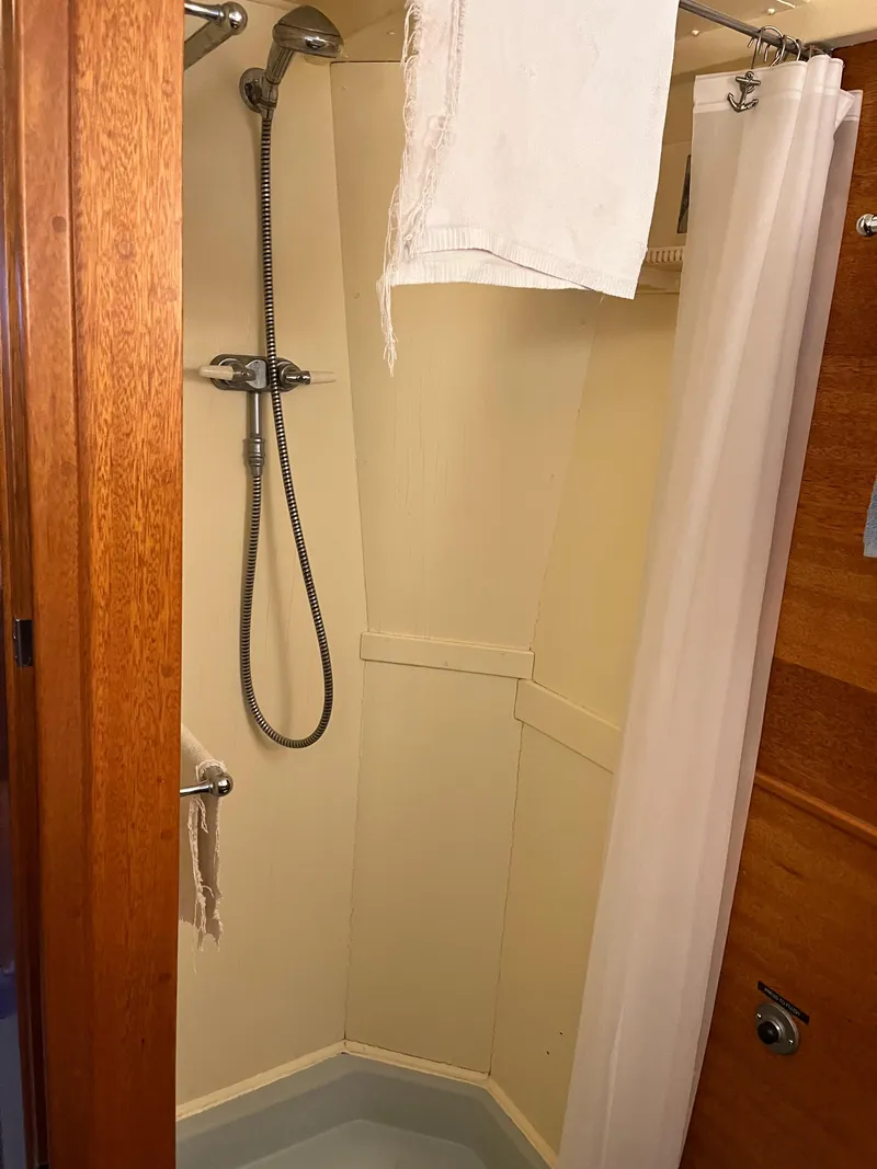 Slide: The Image of Shower area in a 1962 Chris-Craft Constellation boat with wooden accents. - 30