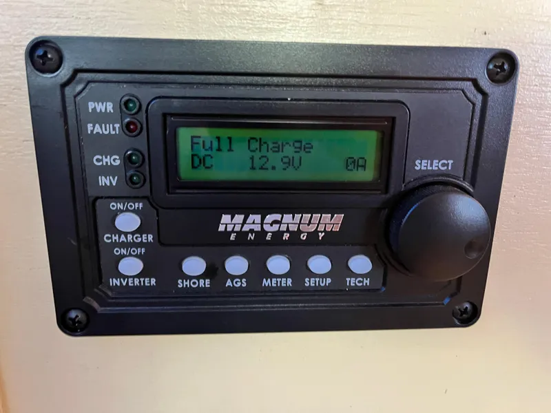 Slide: The Image of Magnum Energy control panel displaying full charge at 12.9V on a 1962 Chris-Craft Constellation. - 9