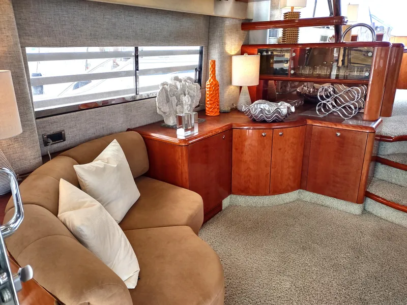 Slide: The Image of Luxurious interior of a 1997 Fairline 66 yacht with elegant decor and comfortable seating. - 10