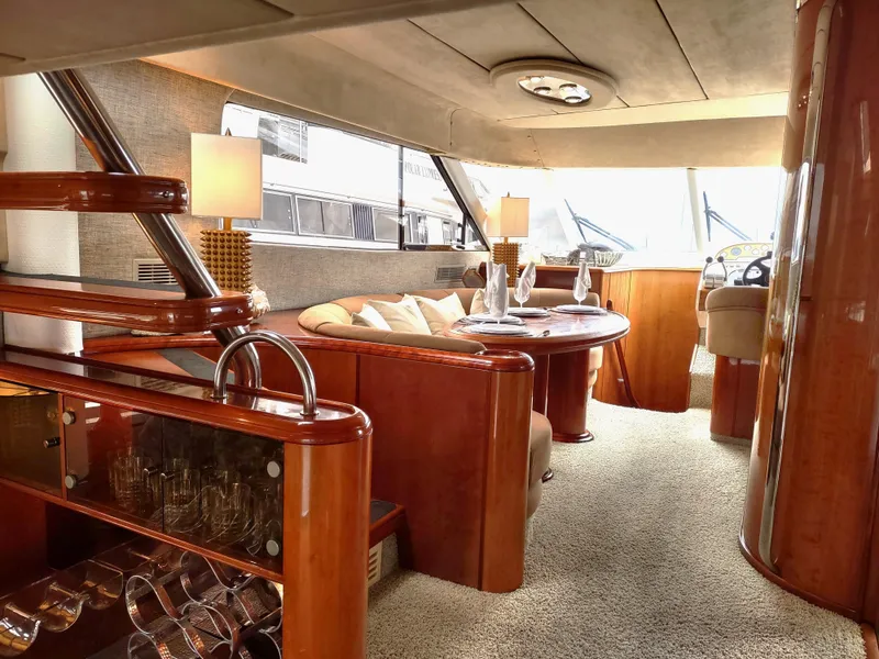 Slide: The Image of Luxurious interior of a 1997 Fairline 66 yacht with elegant wooden finishes. - 13