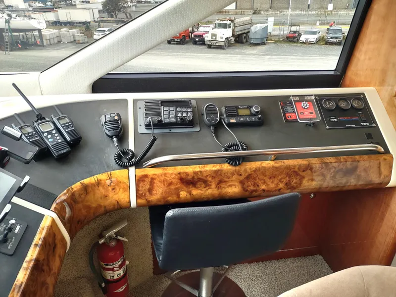 Slide: The Image of Fairline 66 yacht helm station, 1997 model, with communication equipment and control panel. - 21