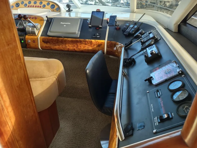 Slide: The Image of Fairline 66 yacht 1997 helm station with navigation equipment and controls. - 23
