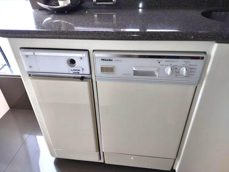 Slide: The Image of Built-in Miele dishwasher in a 1997 Fairline 66 yacht kitchen. - 30