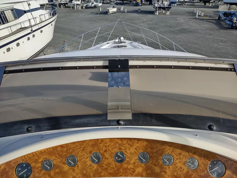 Slide: The Image of Control panel view of a 1997 Fairline 66 yacht in a marina. - 31
