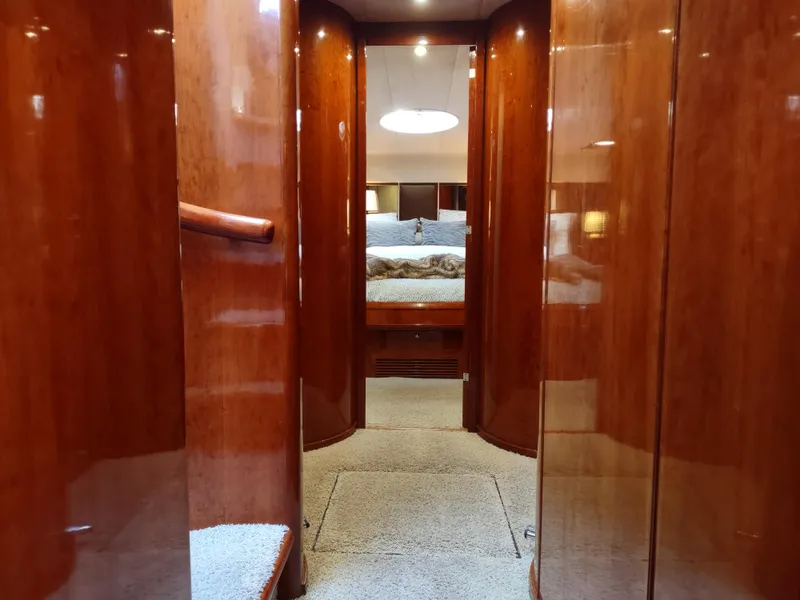Slide: The Image of Interior hallway of 1997 Fairline 66 yacht with polished wood finish. - 35