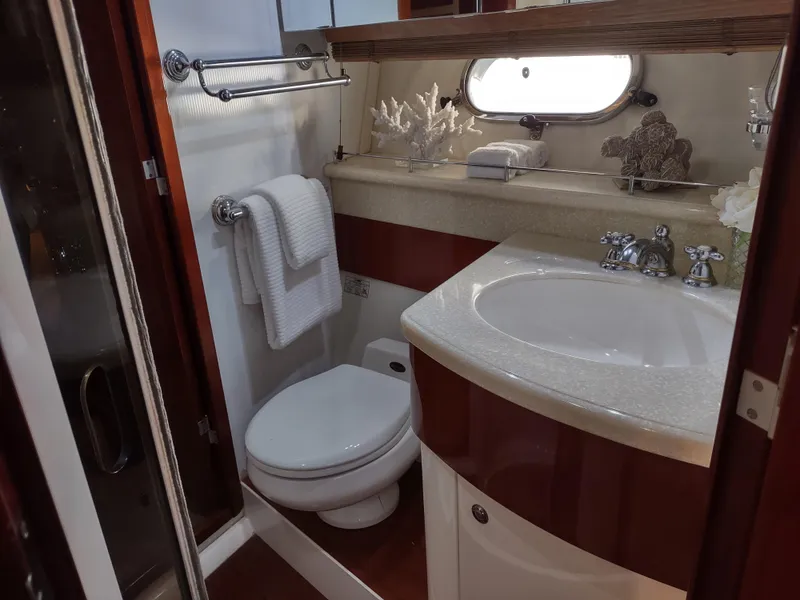 Slide: The Image of Luxurious bathroom in a 1997 Fairline 66 yacht with modern fixtures and elegant decor. - 37