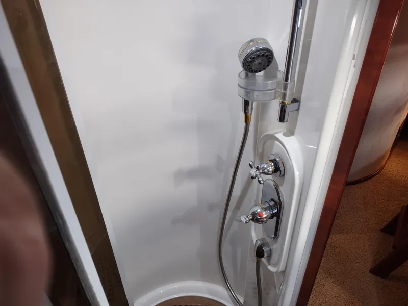 Slide: The Image of Shower area in a 1997 Fairline 66 yacht with chrome fixtures. - 40