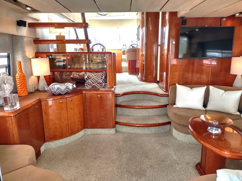 Slide: The Image of Luxurious interior of a 1997 Fairline 66 yacht with elegant wood finishes and modern decor. - 6