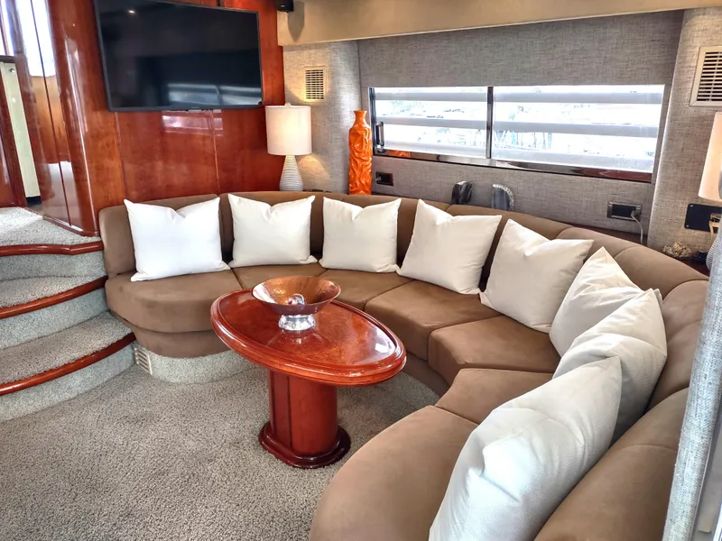 Slide: The Image of Luxurious interior of 1997 Fairline 66 yacht with curved sofa and modern decor. - 7