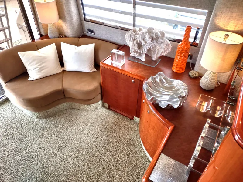 Slide: The Image of Luxurious interior of a 1997 Fairline 66 yacht with elegant decor and comfortable seating. - 8