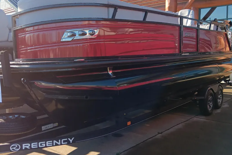 The Image of 2024 Regency 250 DL3 pontoon boat with red and black exterior. - 0
