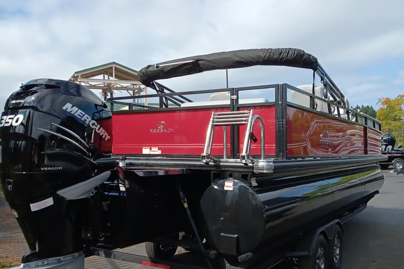 Slide: The Image of 2024 Regency 250 DL3 pontoon boat with Mercury 350 Verado engine, red and black exterior. - 3