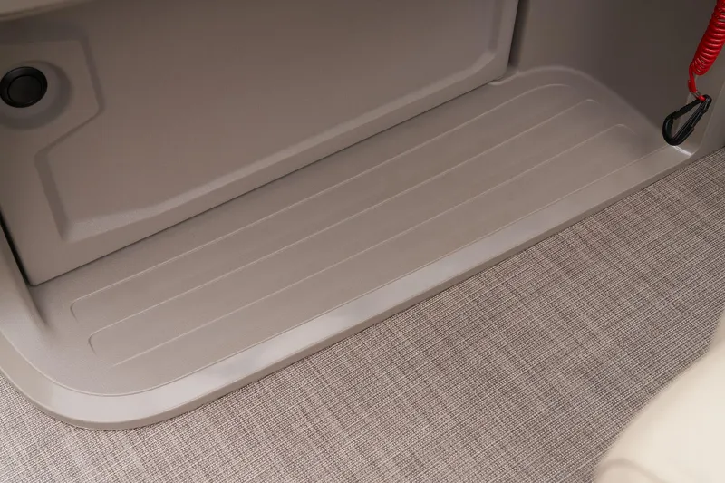 Slide: The Image of 2024 Sun Tracker Fishin' Barge 22 XP3 interior flooring and storage compartment. - 41