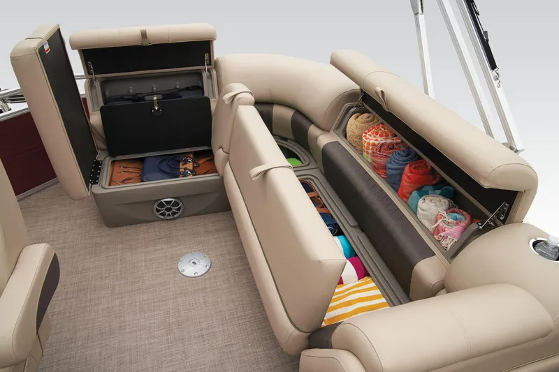 Slide: The Image of 2024 Sun Tracker Party Barge 20 DLX interior seating area with beige upholstery. - 41